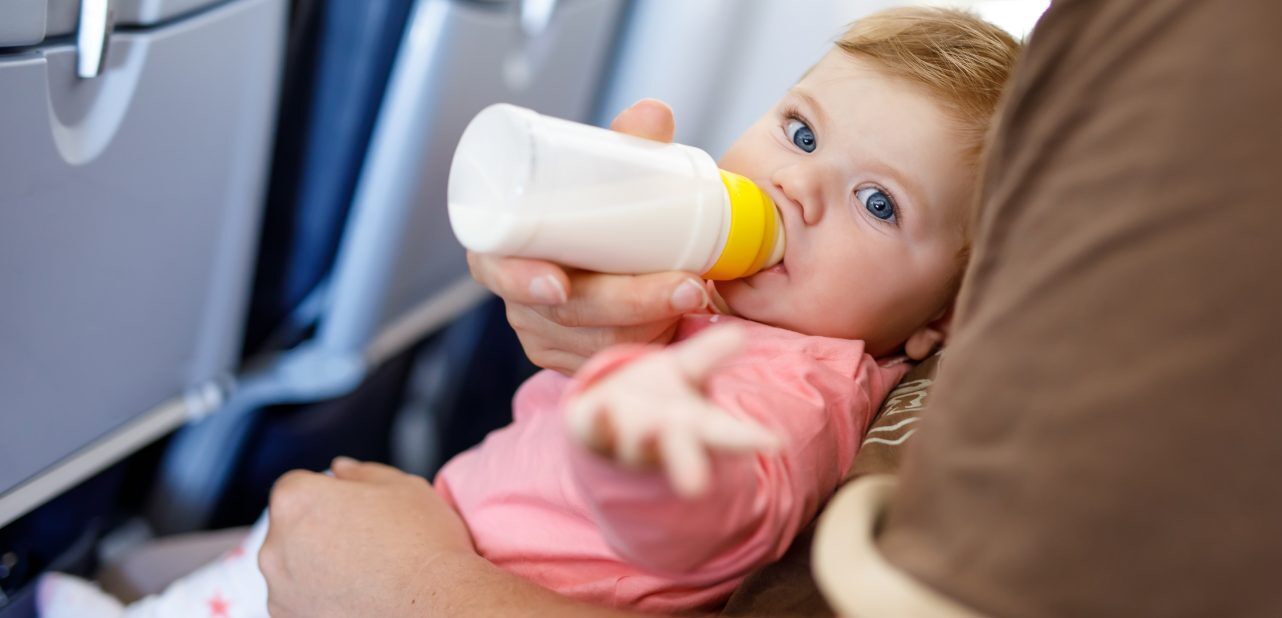 a baby drinking from a bottle