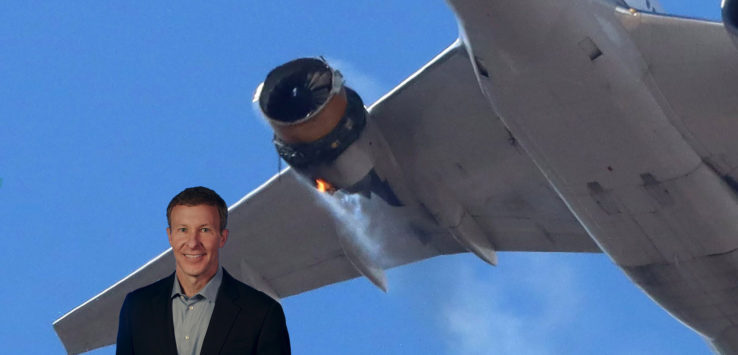 a man standing in front of an airplane