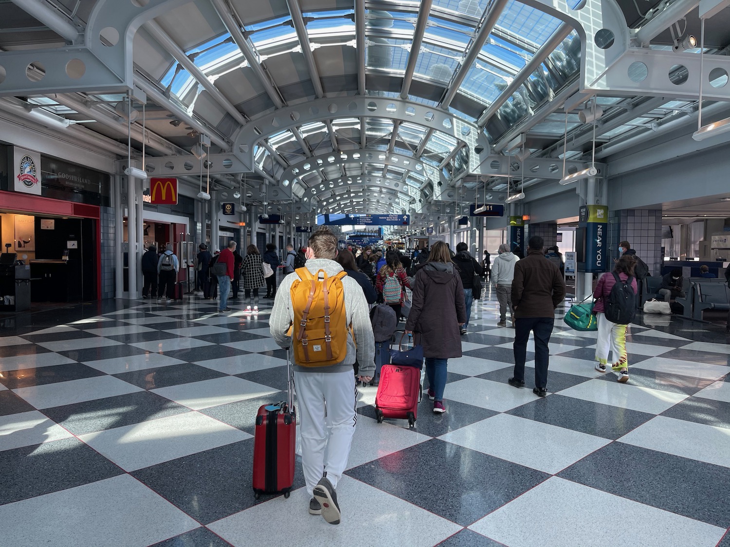 a group of people walking in a terminal