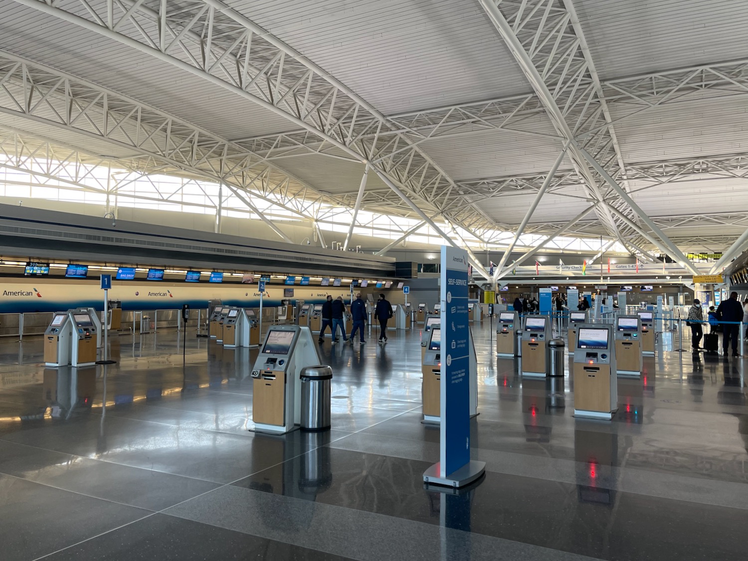 people walking in an airport terminal