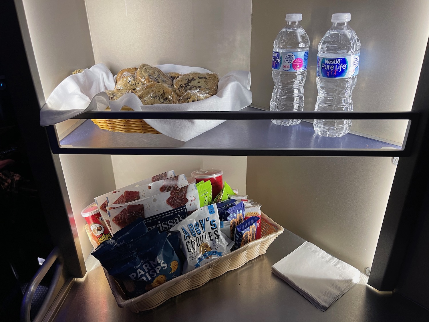 a basket of food and water on shelves