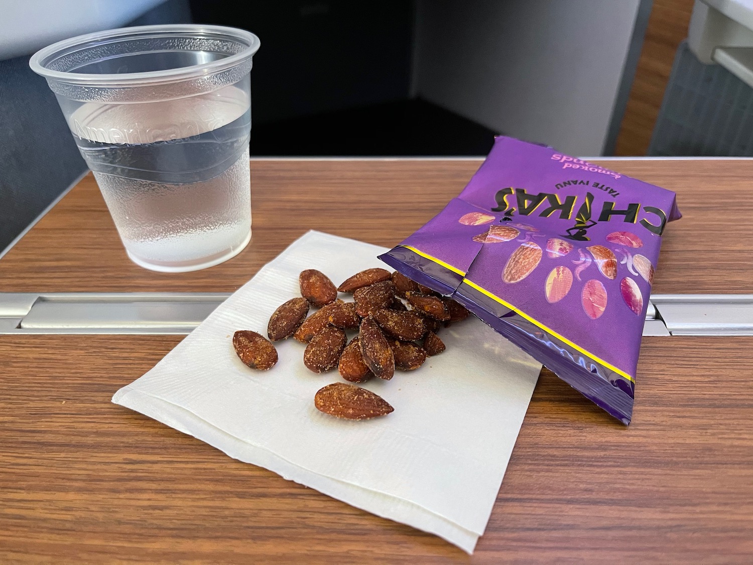 a bag of nuts and a glass of water