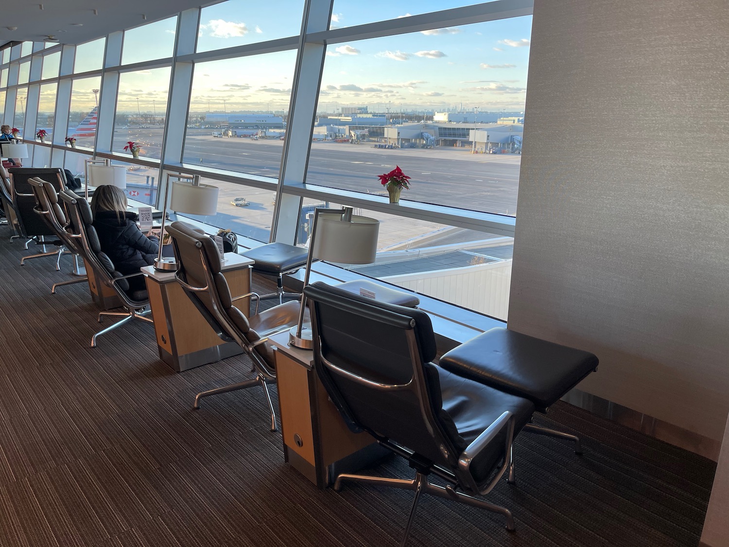 a woman sitting in a chair in an airport