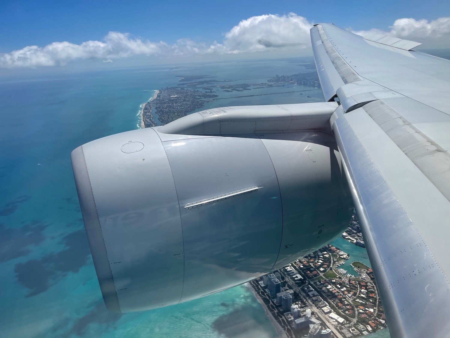 an airplane wing and body of water