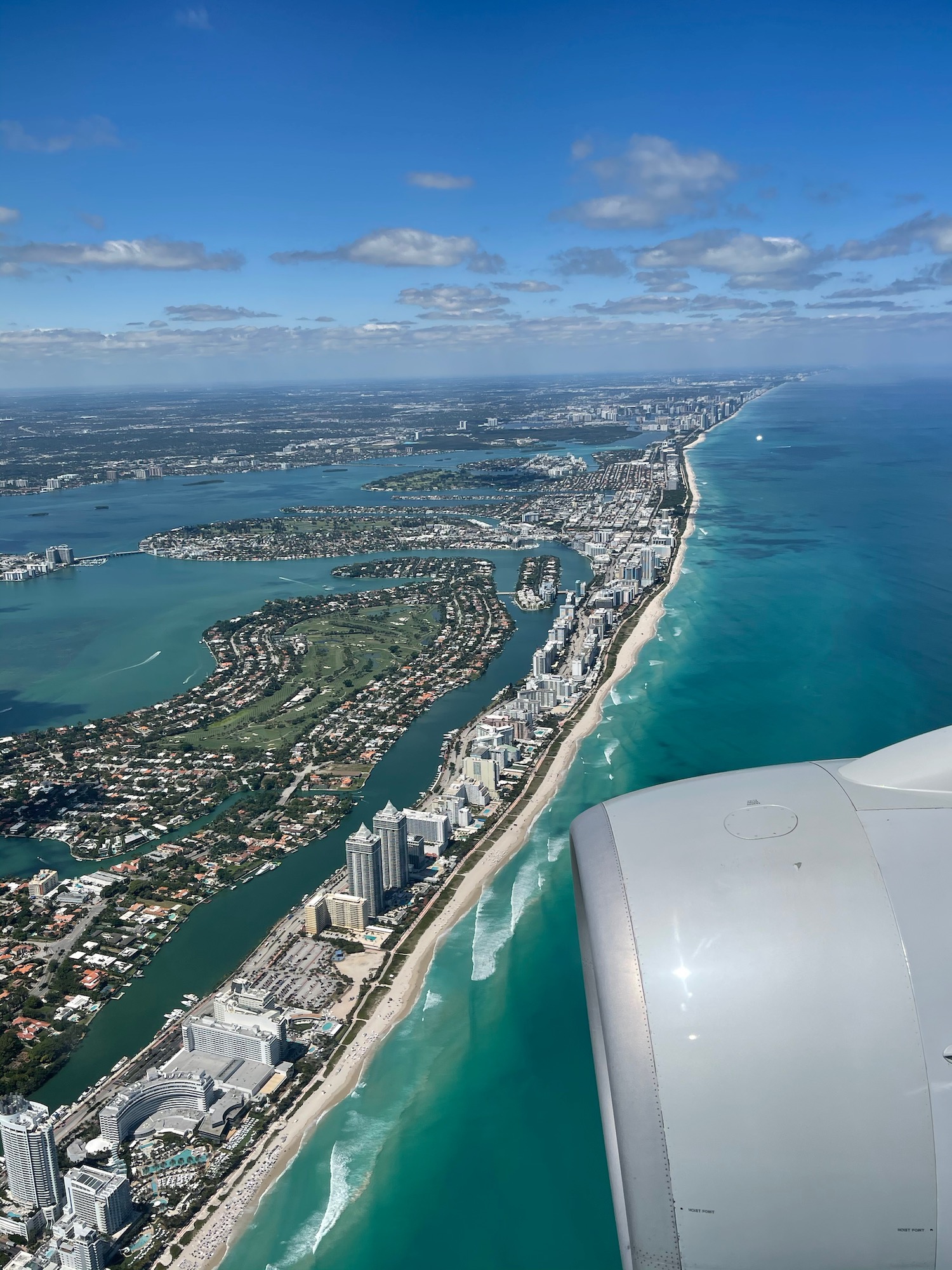 an airplane wing over a city