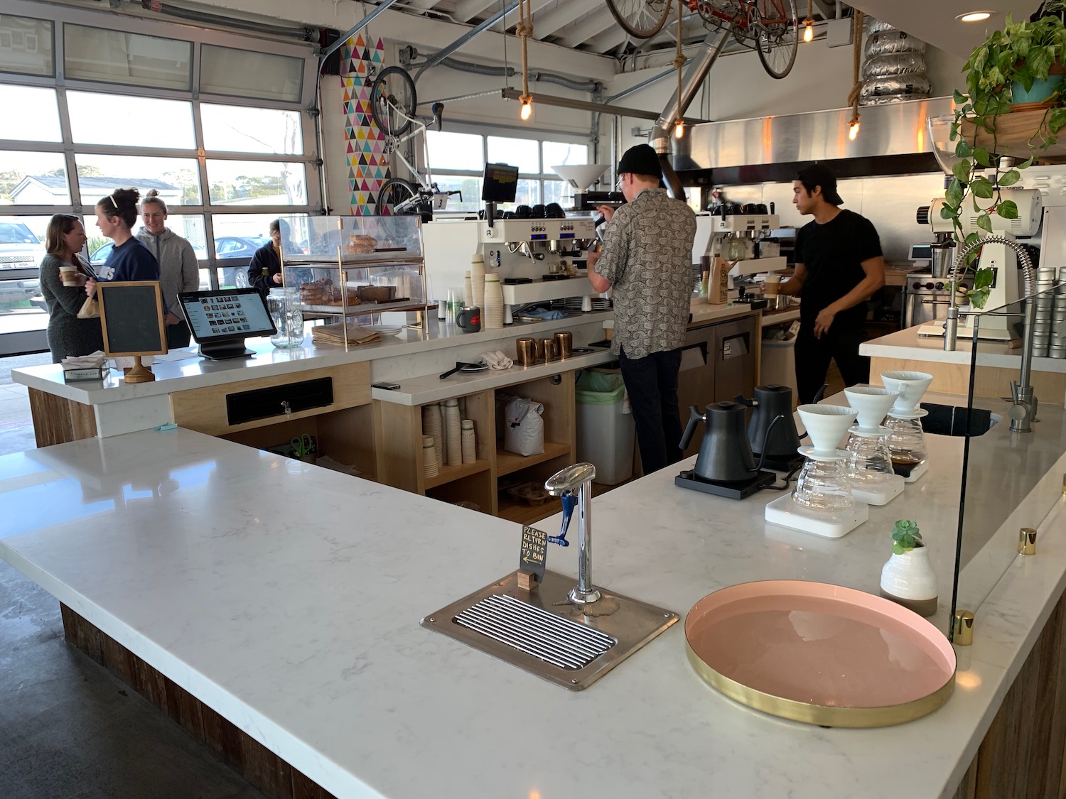 people standing in a coffee shop