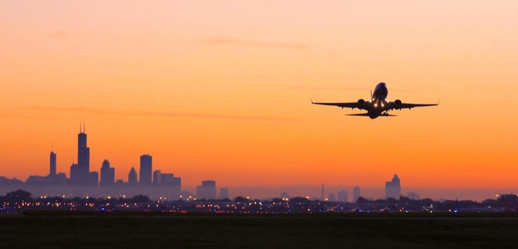 an airplane flying over a city