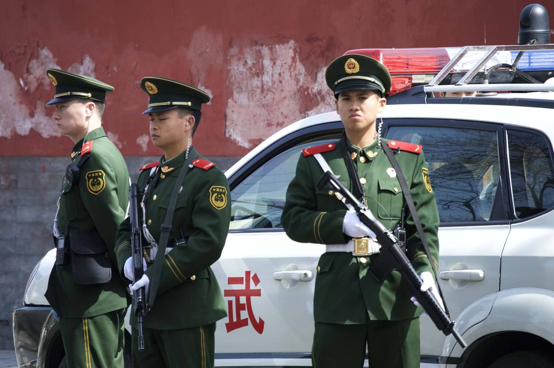 a group of men in military uniforms holding guns