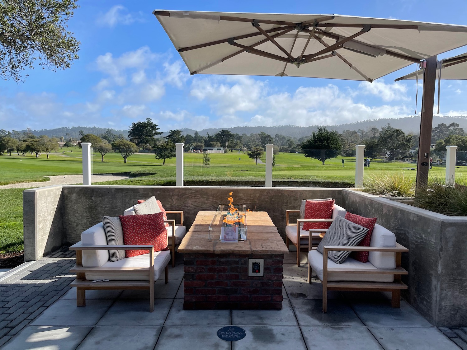 a patio with a table and chairs