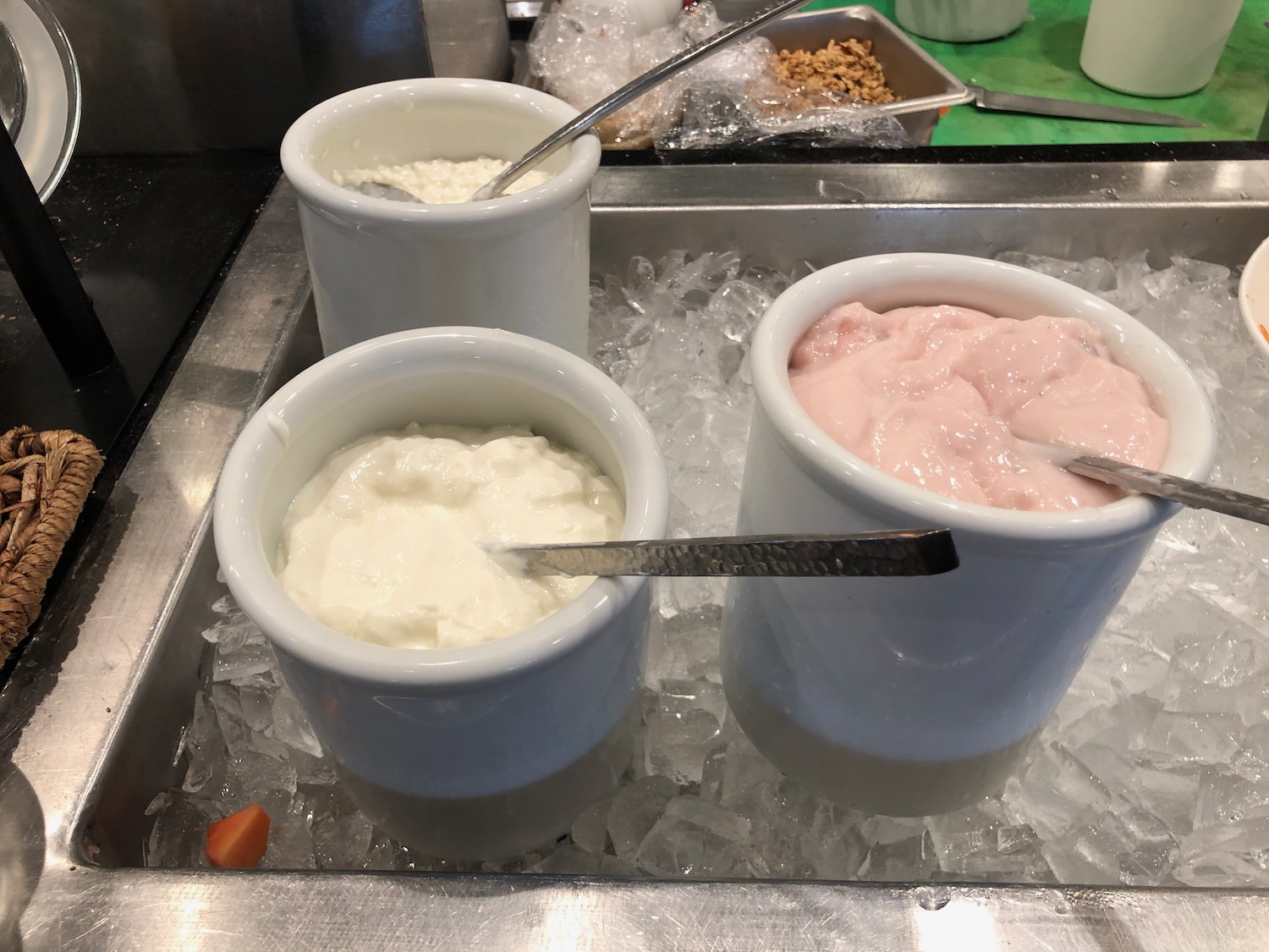 a group of white cups with ice cream in them