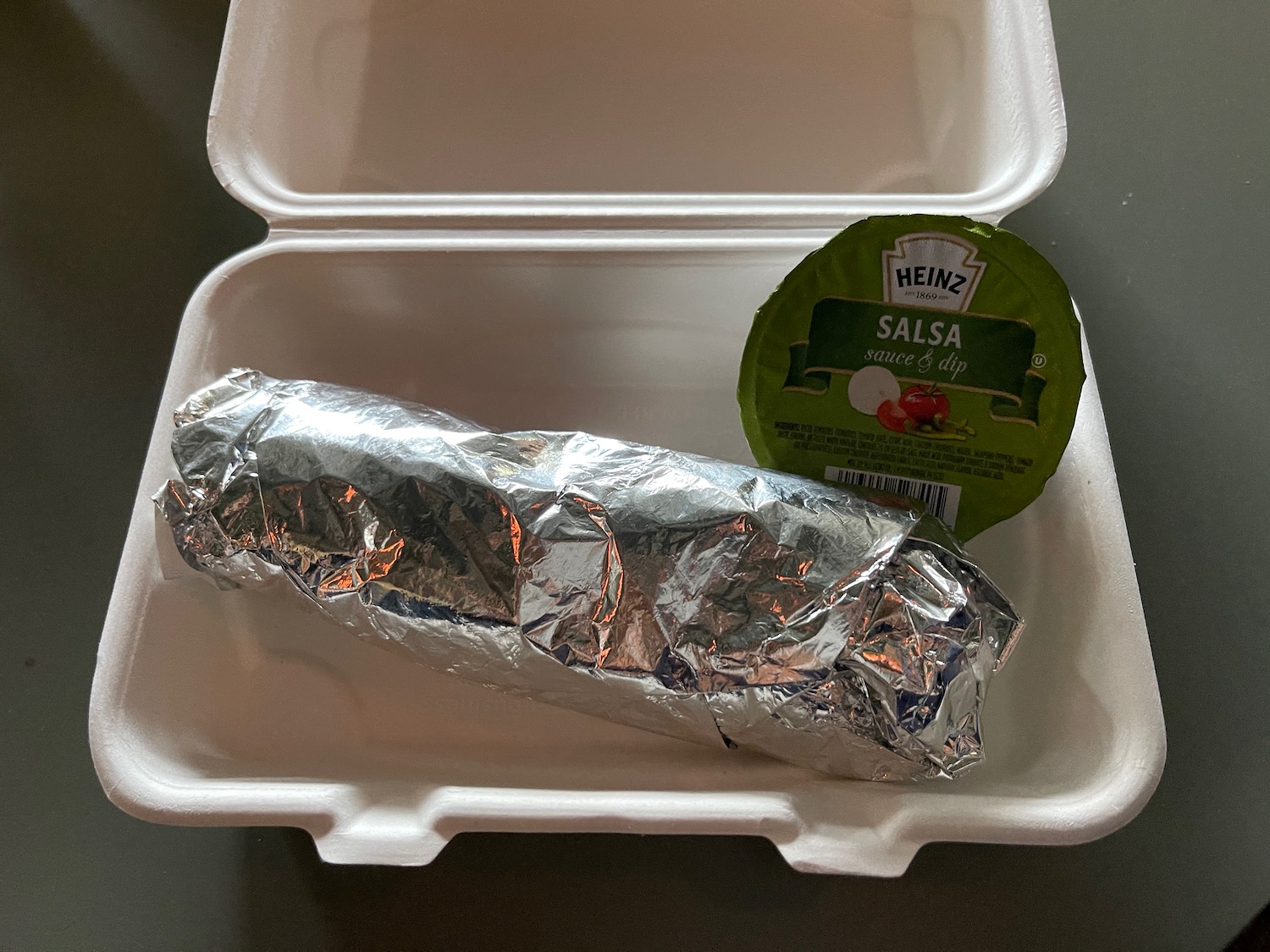 a burrito in a styrofoam container