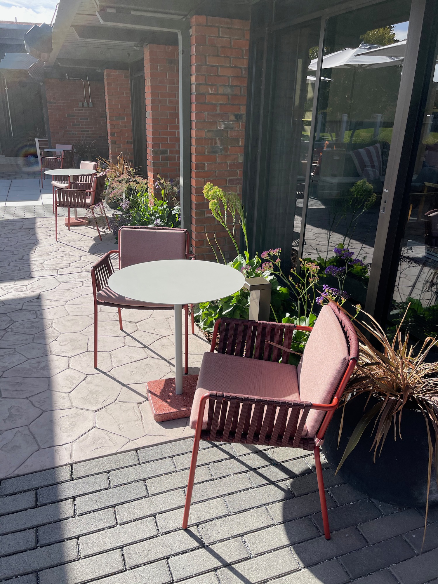 chairs and tables outside a building