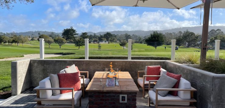 a patio with a table and chairs