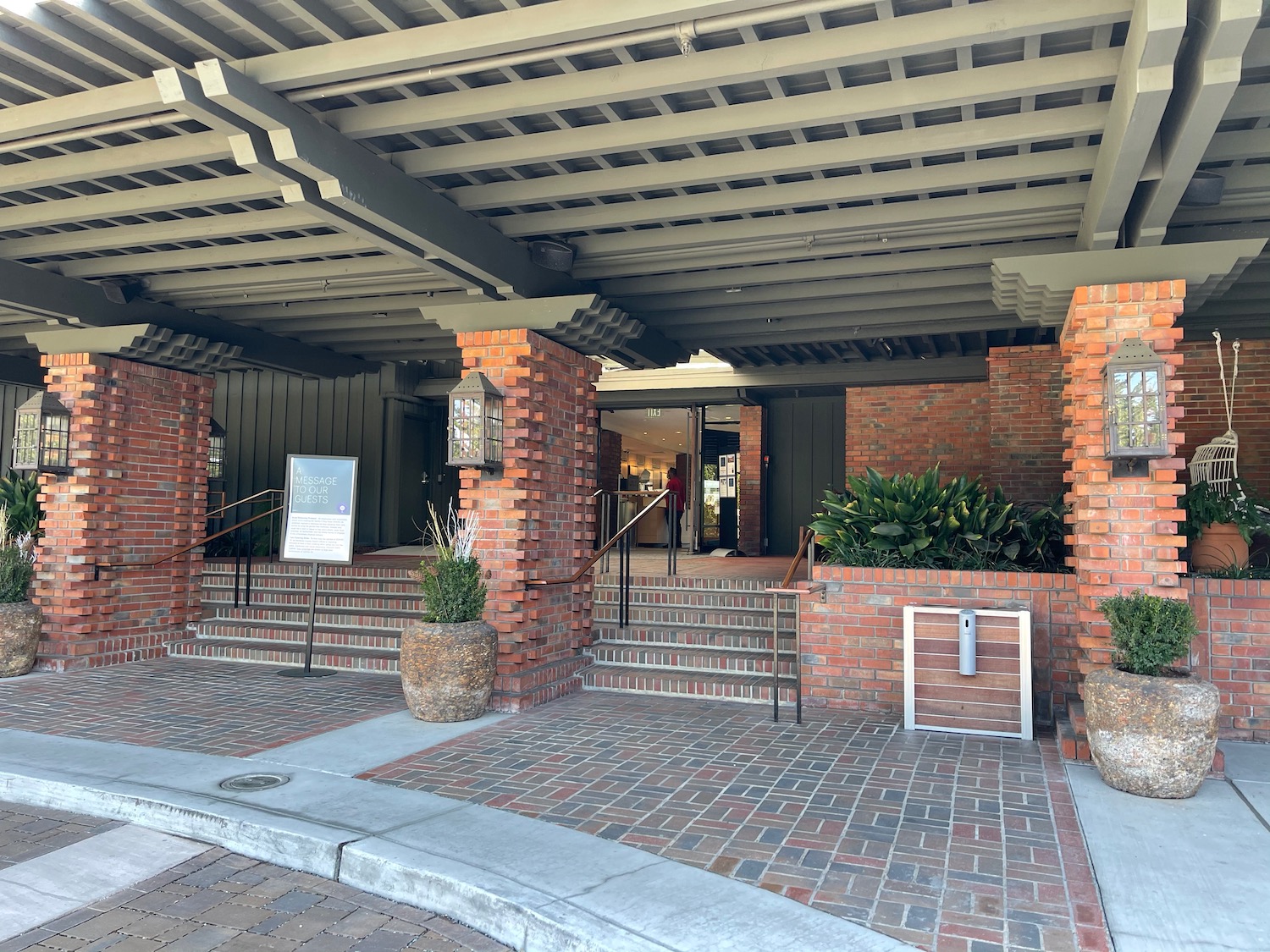 a building with brick pillars and a brick walkway