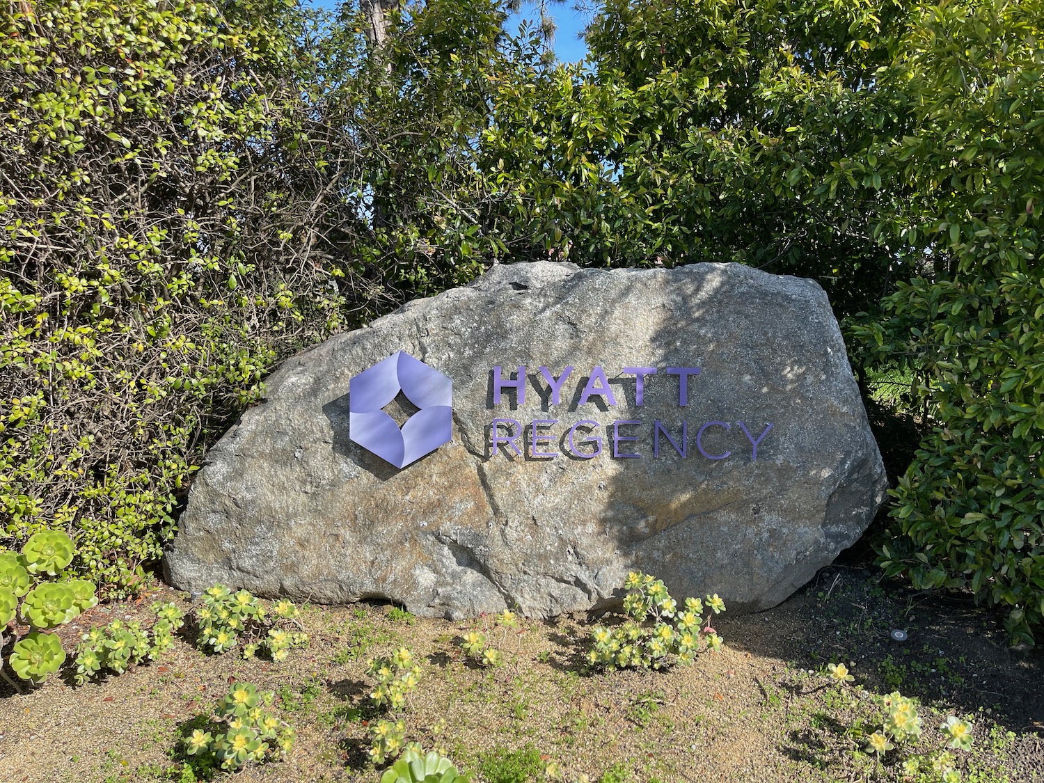 a sign on a rock