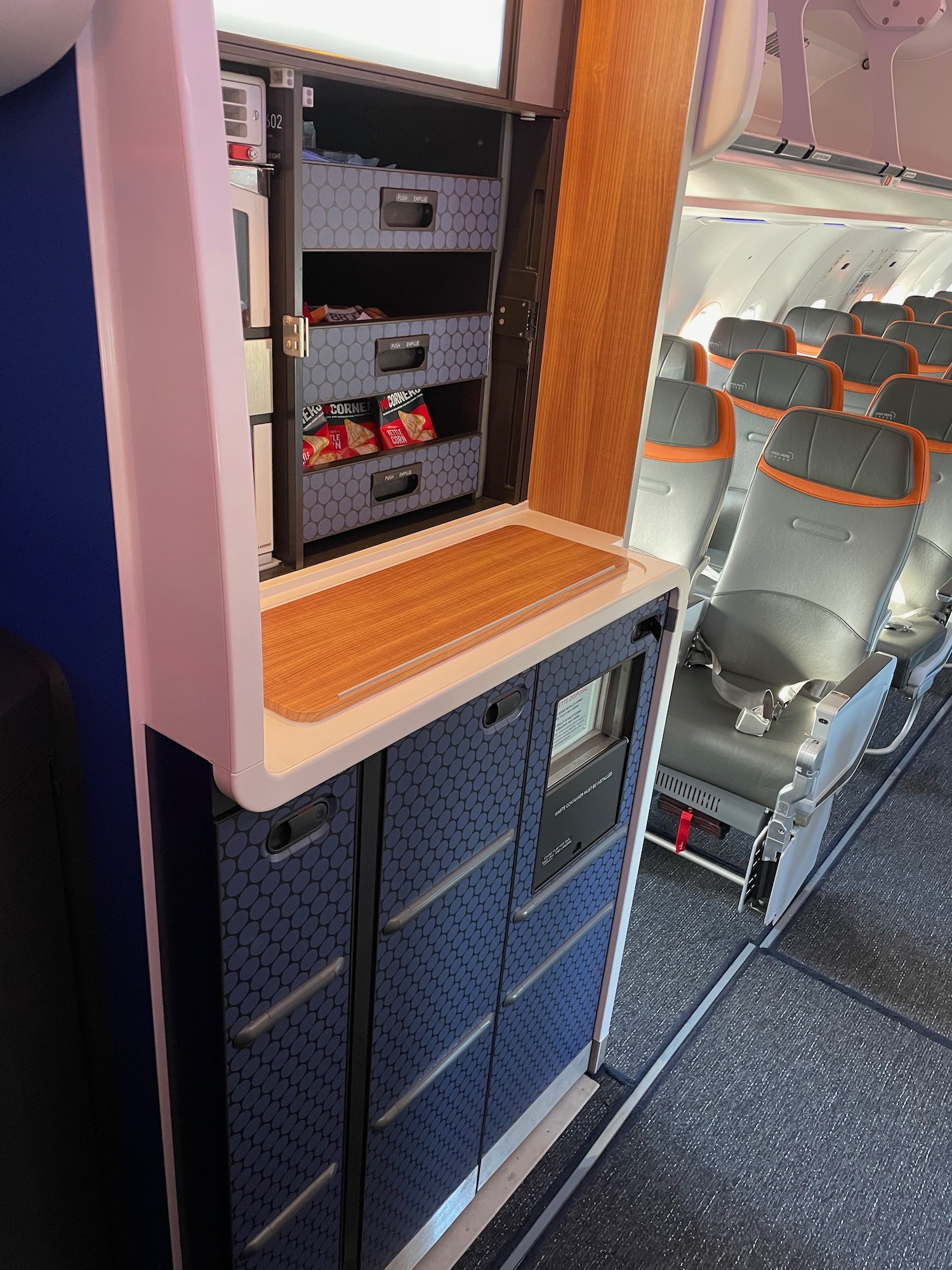 an airplane with a shelf and chairs