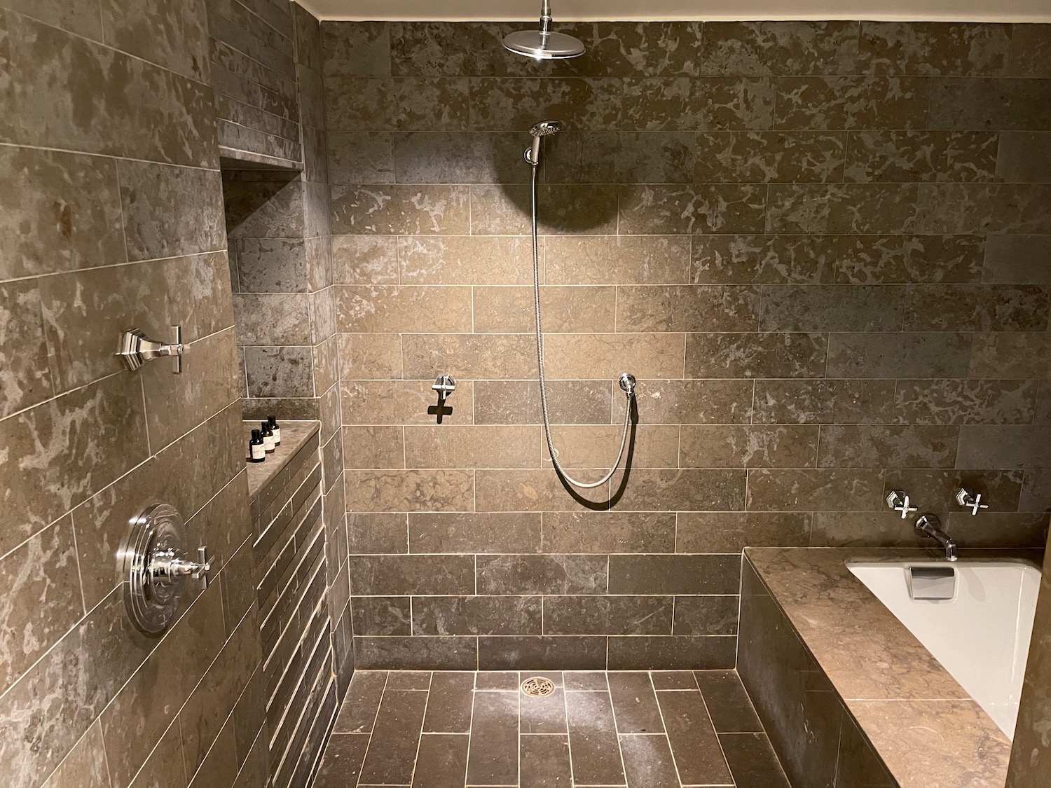 a bathroom with a shower and tub