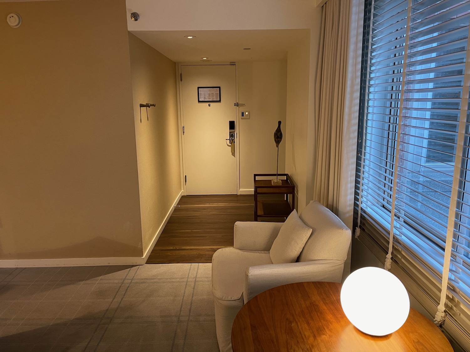 a room with a white chair and a round table