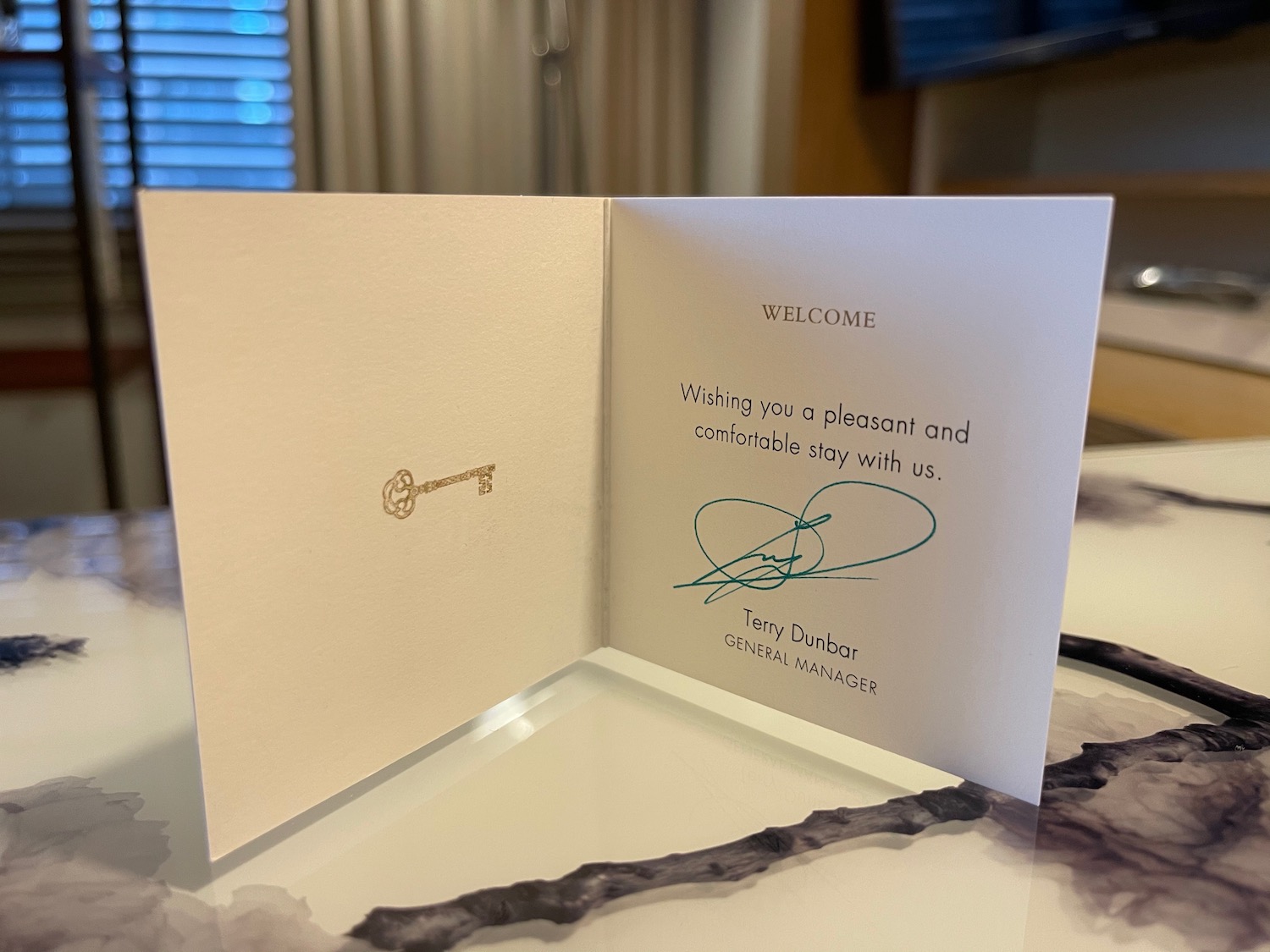 a card with a key and a signature on it