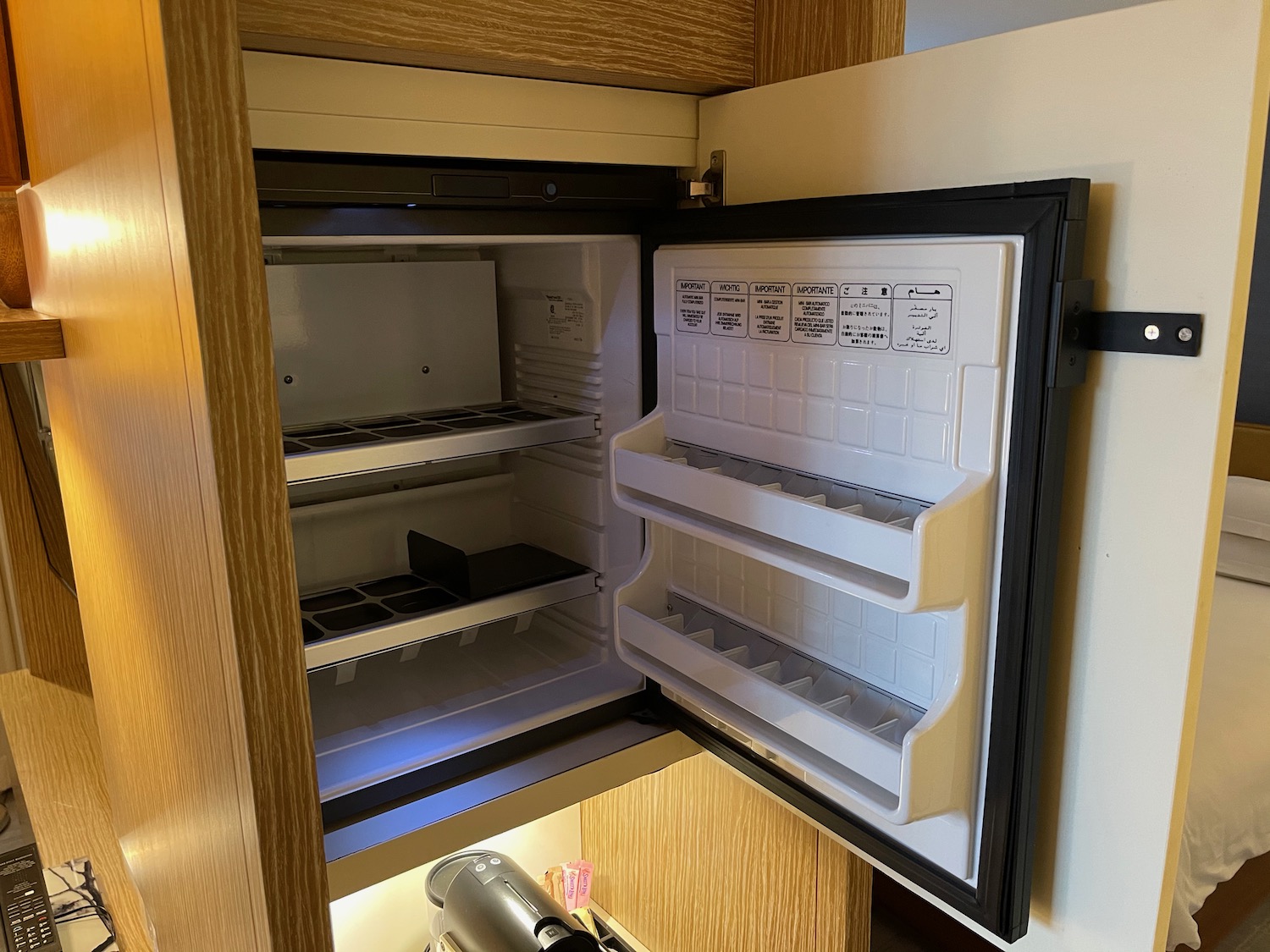 a small refrigerator with shelves