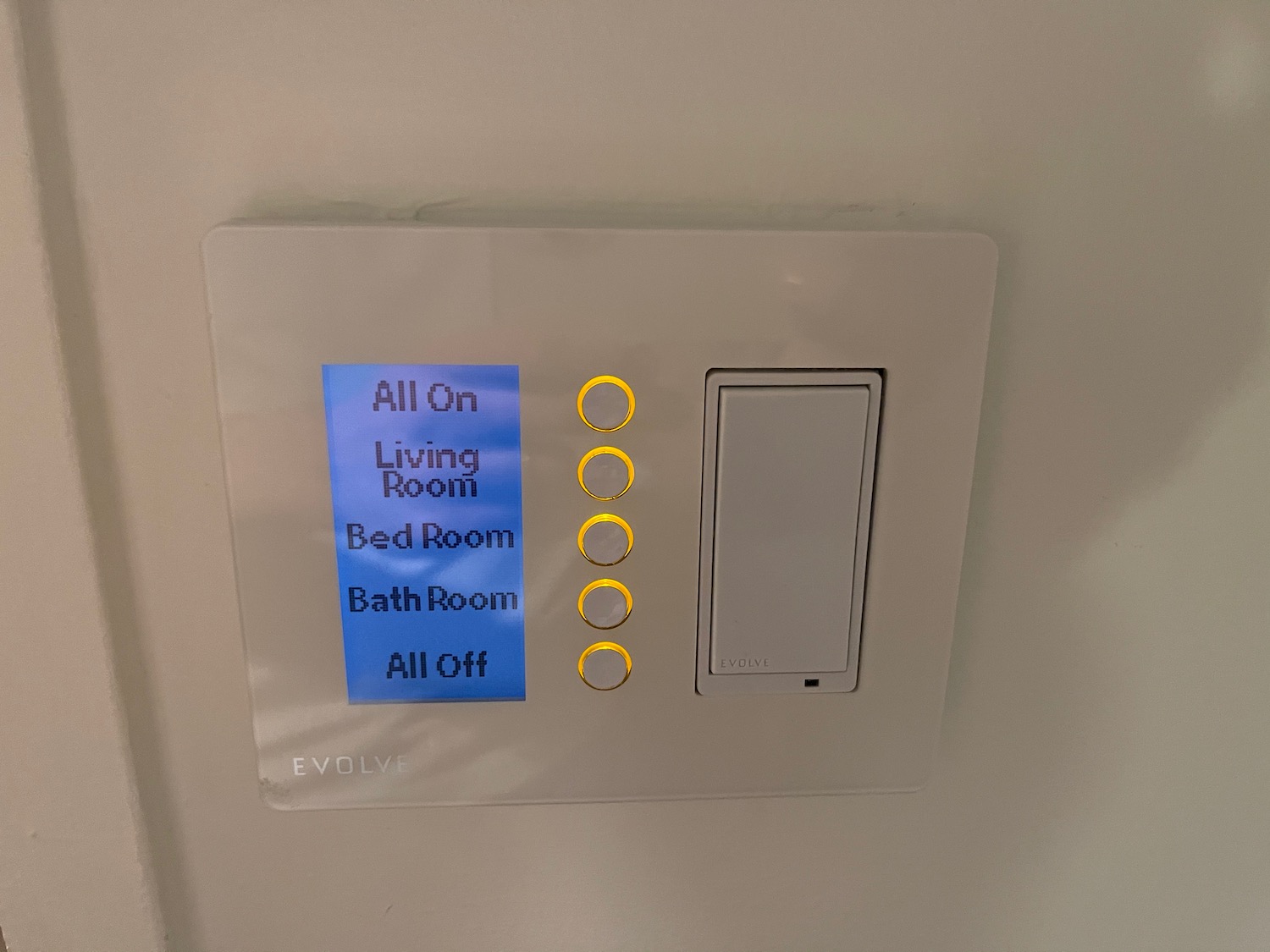 a light switch with buttons and a blue sign