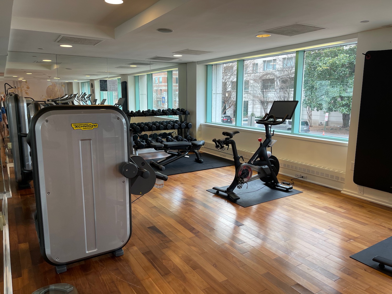 a room with exercise bikes and a large window