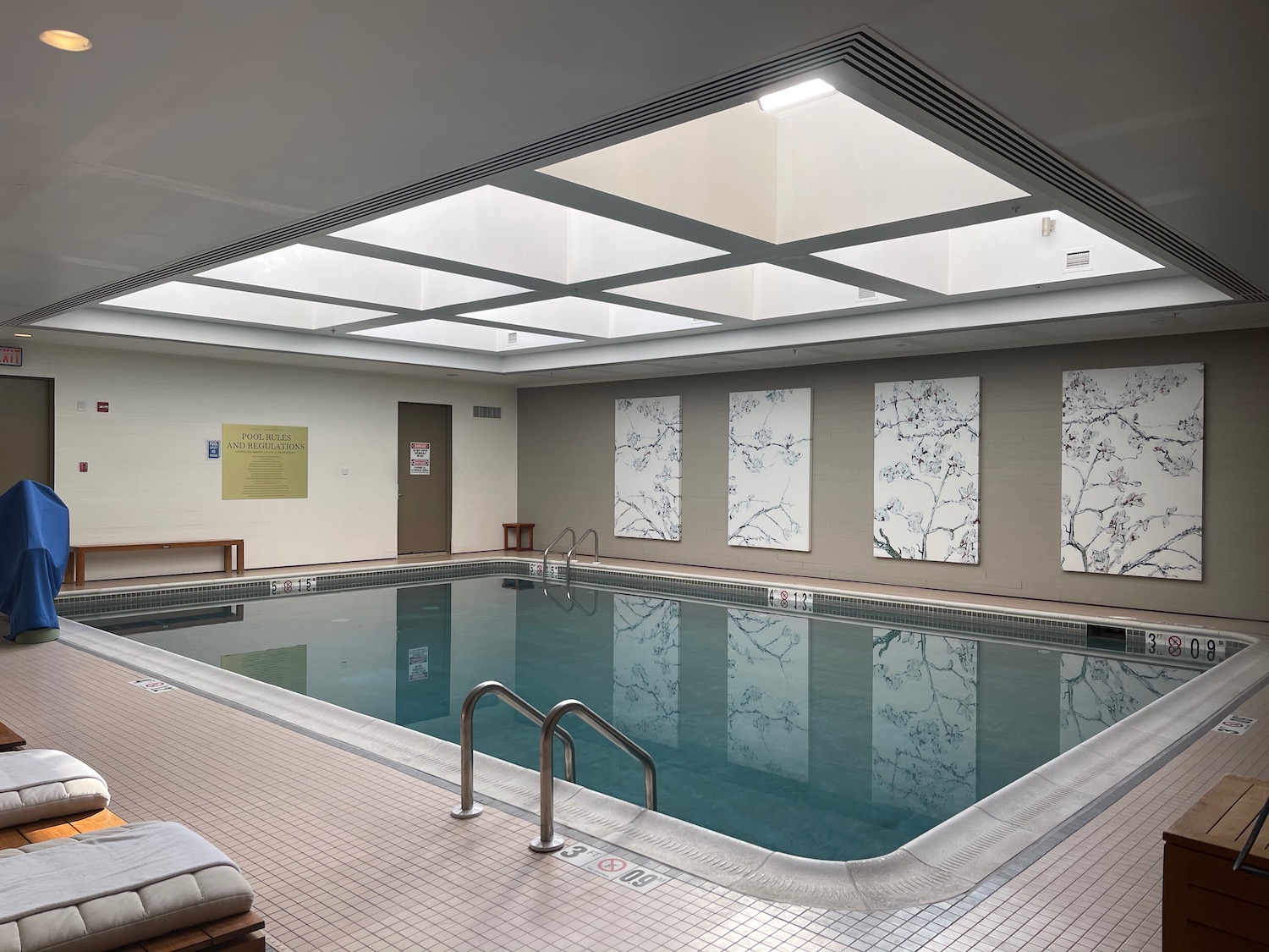 a indoor pool with a skylight