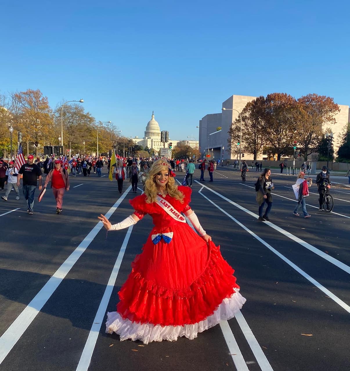 a woman in a red dress posing for a picture