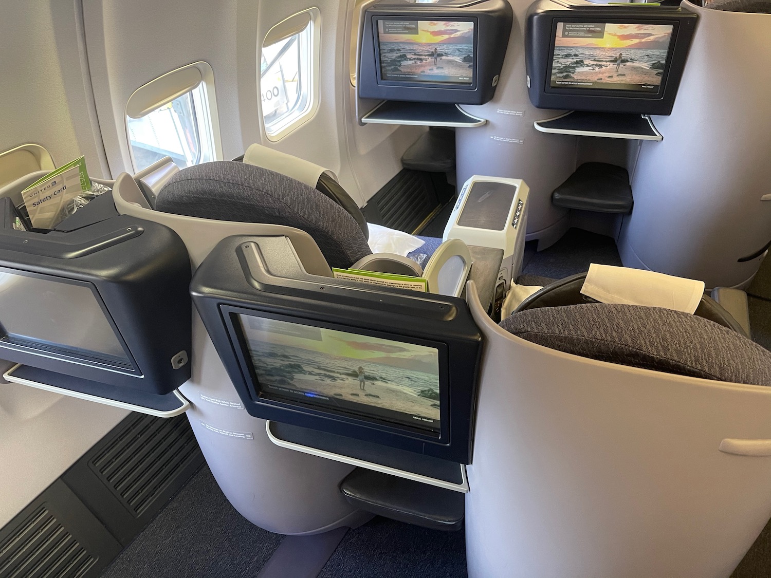 a row of tvs on the side of an airplane