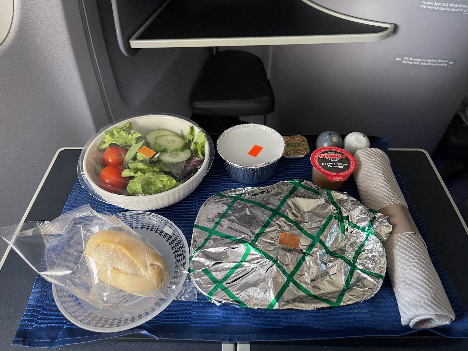 food on a tray on a plane