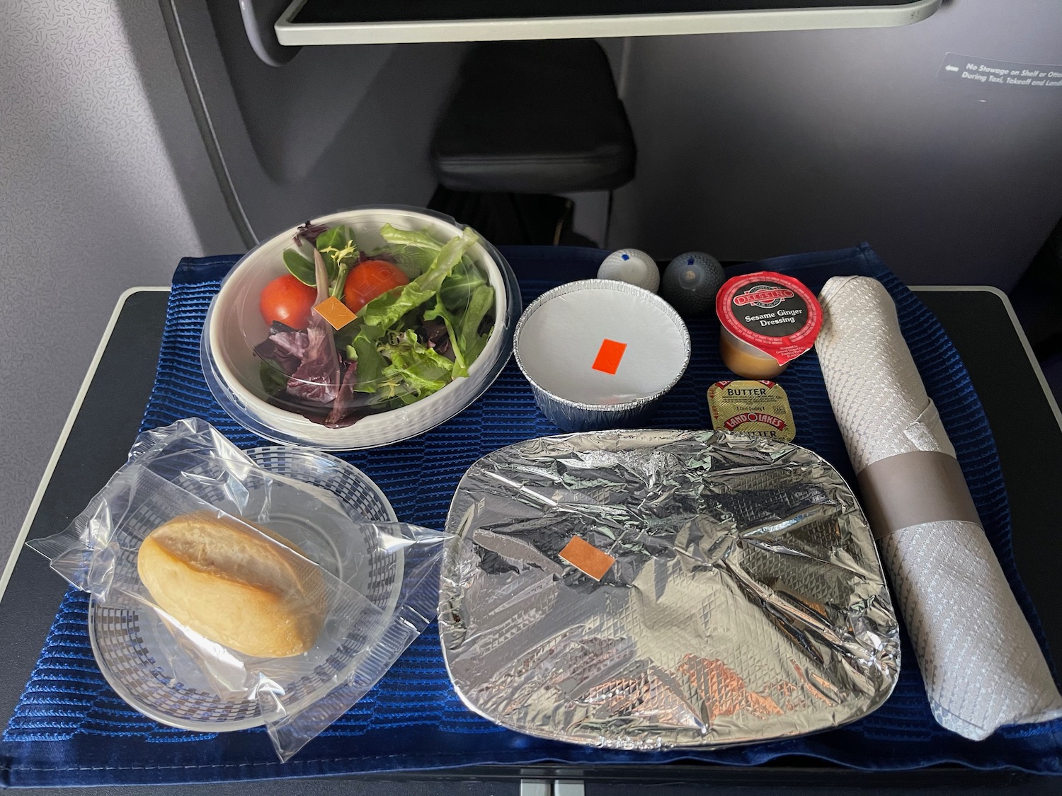 food on a tray on a plane