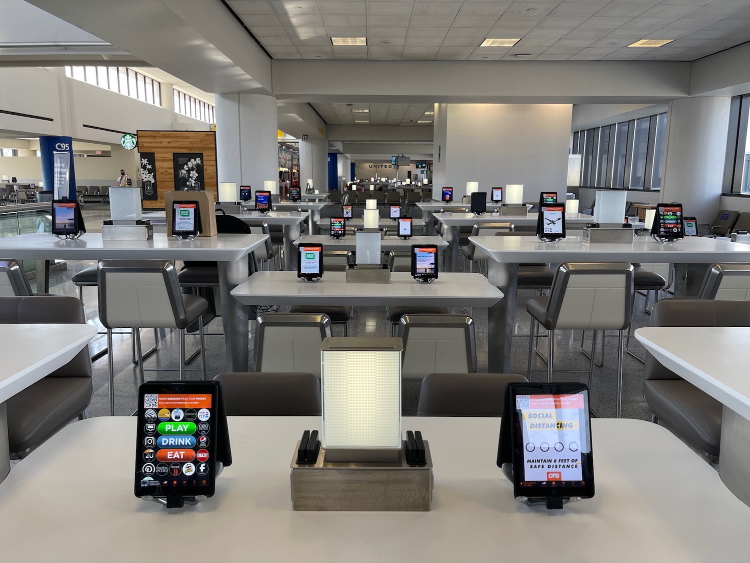 a room with tables and chairs with electronic devices