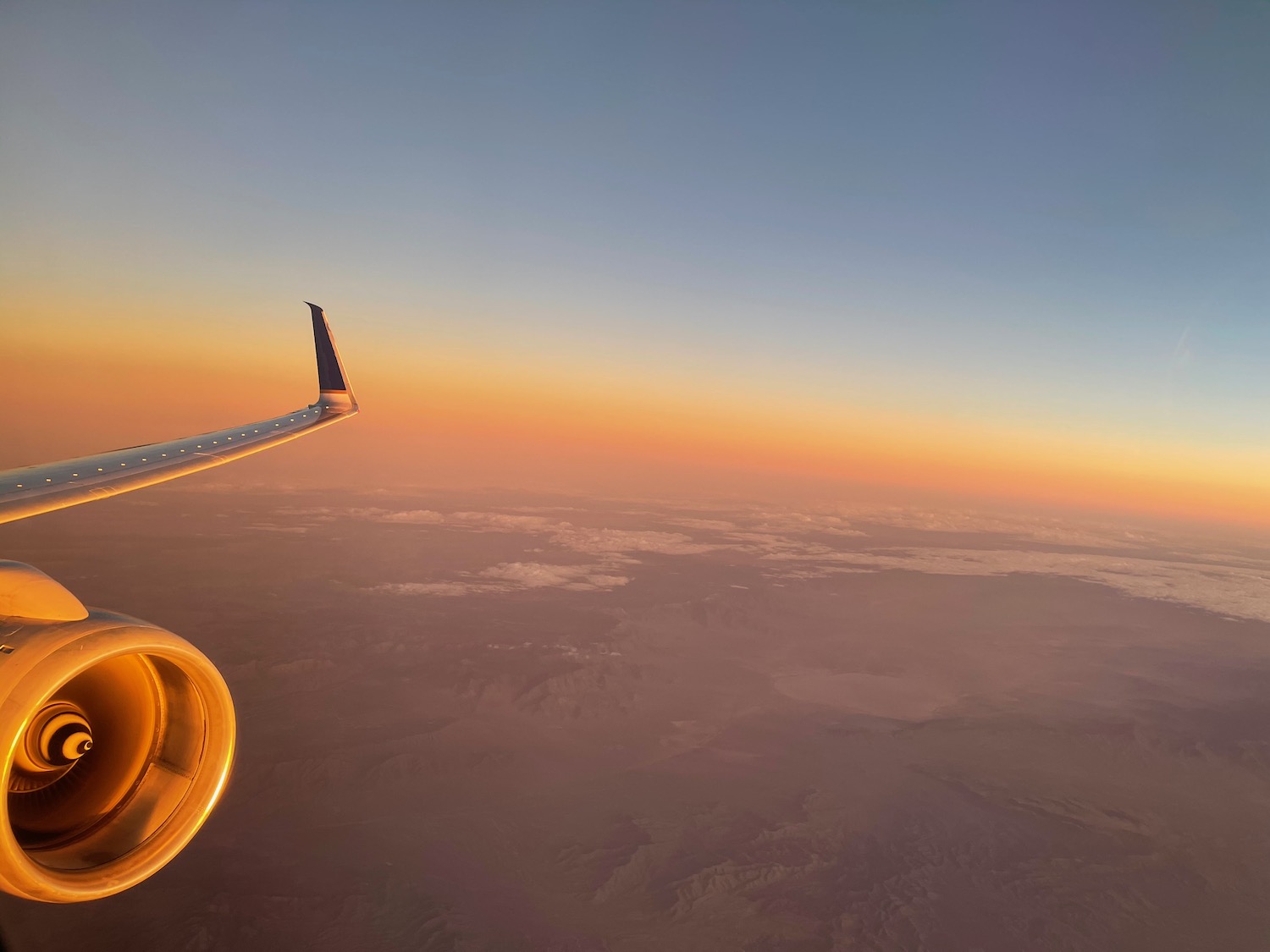 an airplane wing in the sky