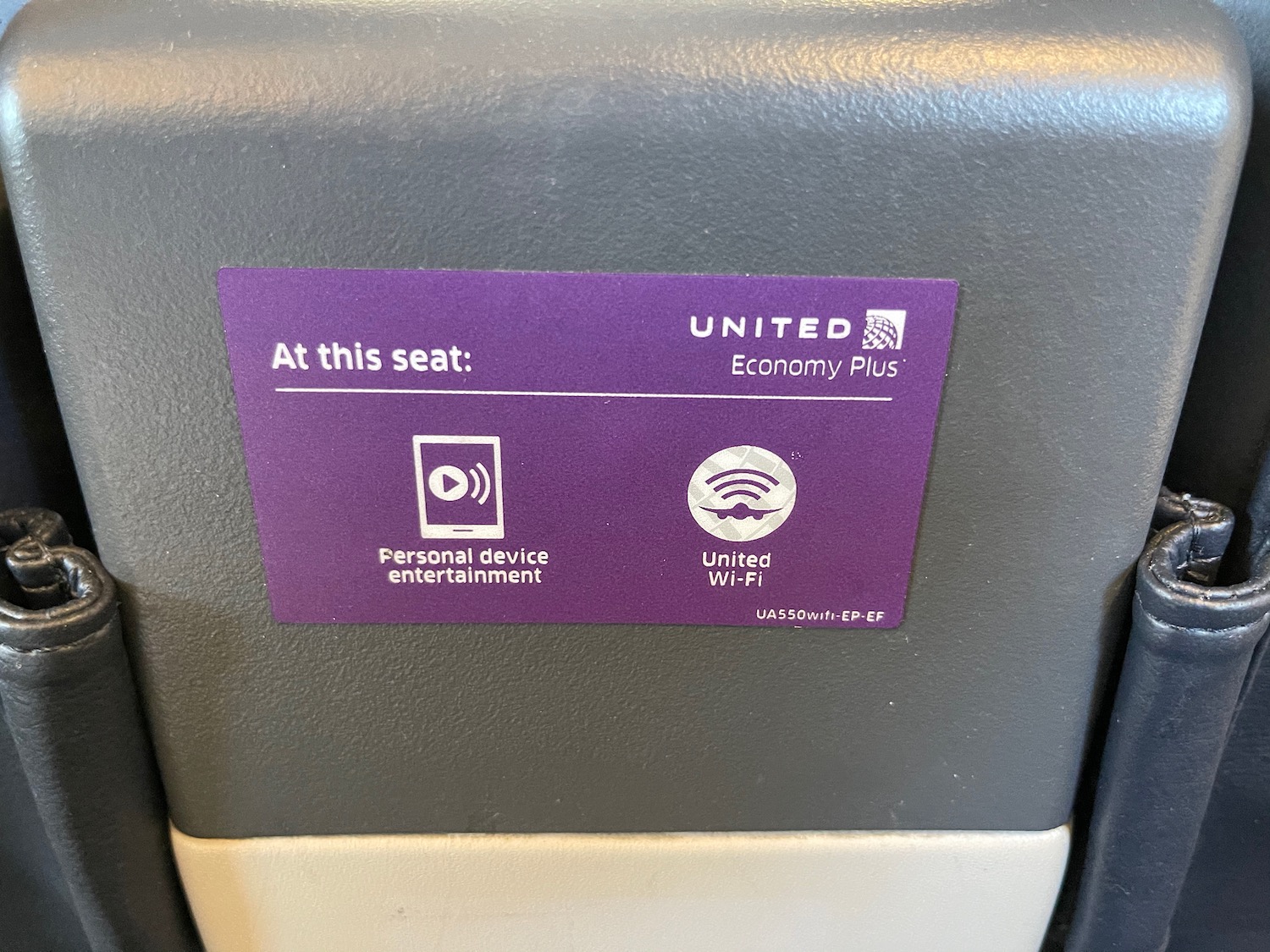 a purple sticker on a grey surface