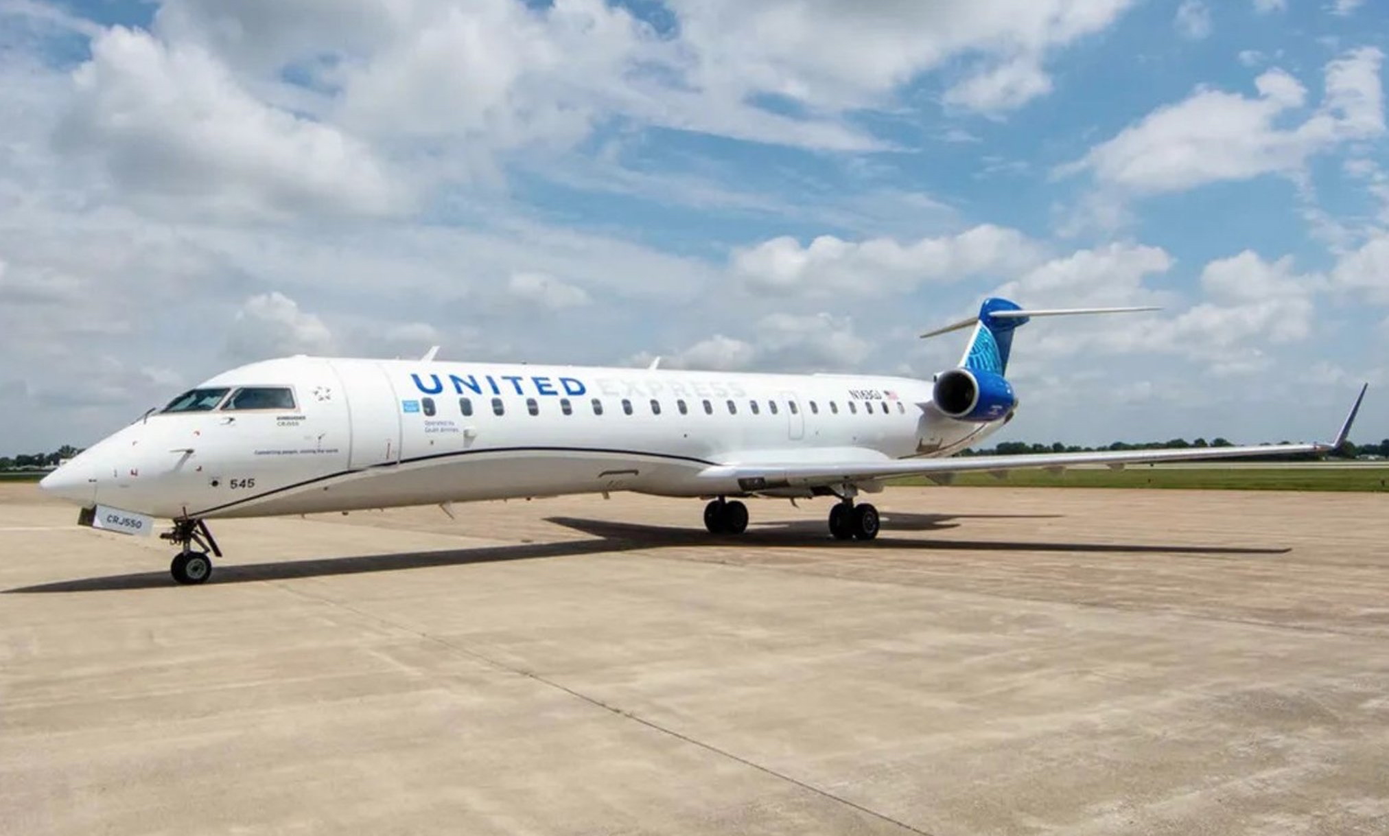 a white airplane on a runway