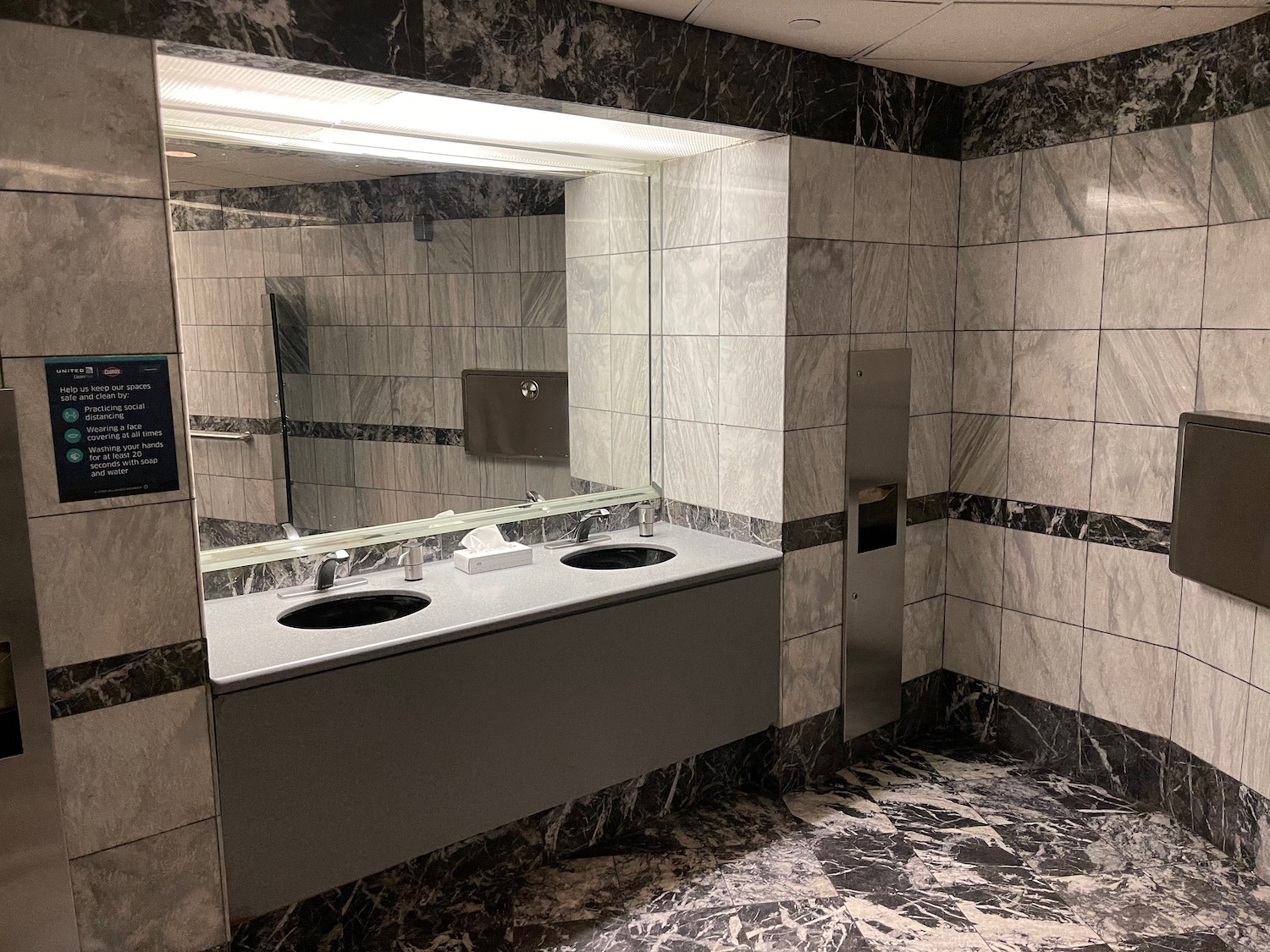 a bathroom with sinks and mirrors