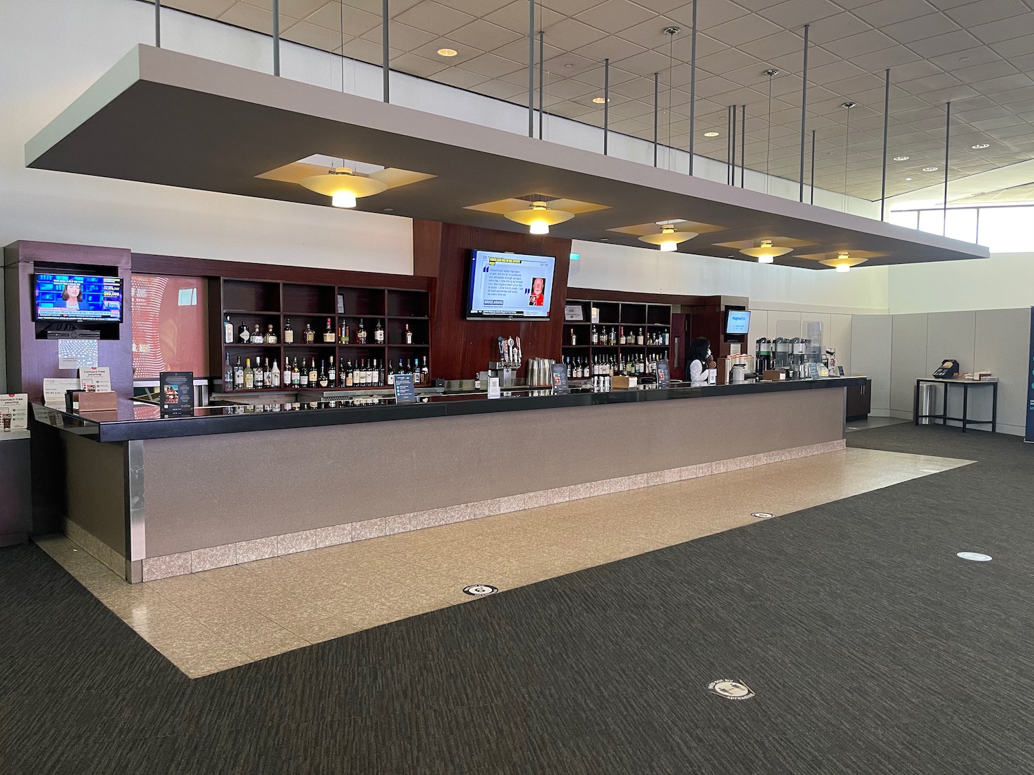 a bar with bottles on the shelves