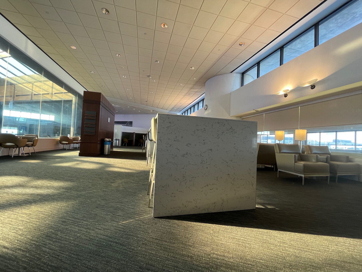 a large white cube in a room with windows