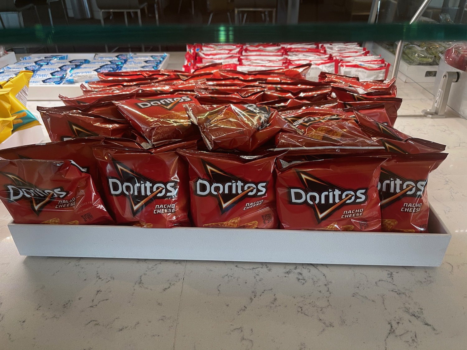a group of red bags of chips