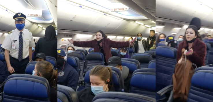 a woman standing in a plane with a group of people wearing masks