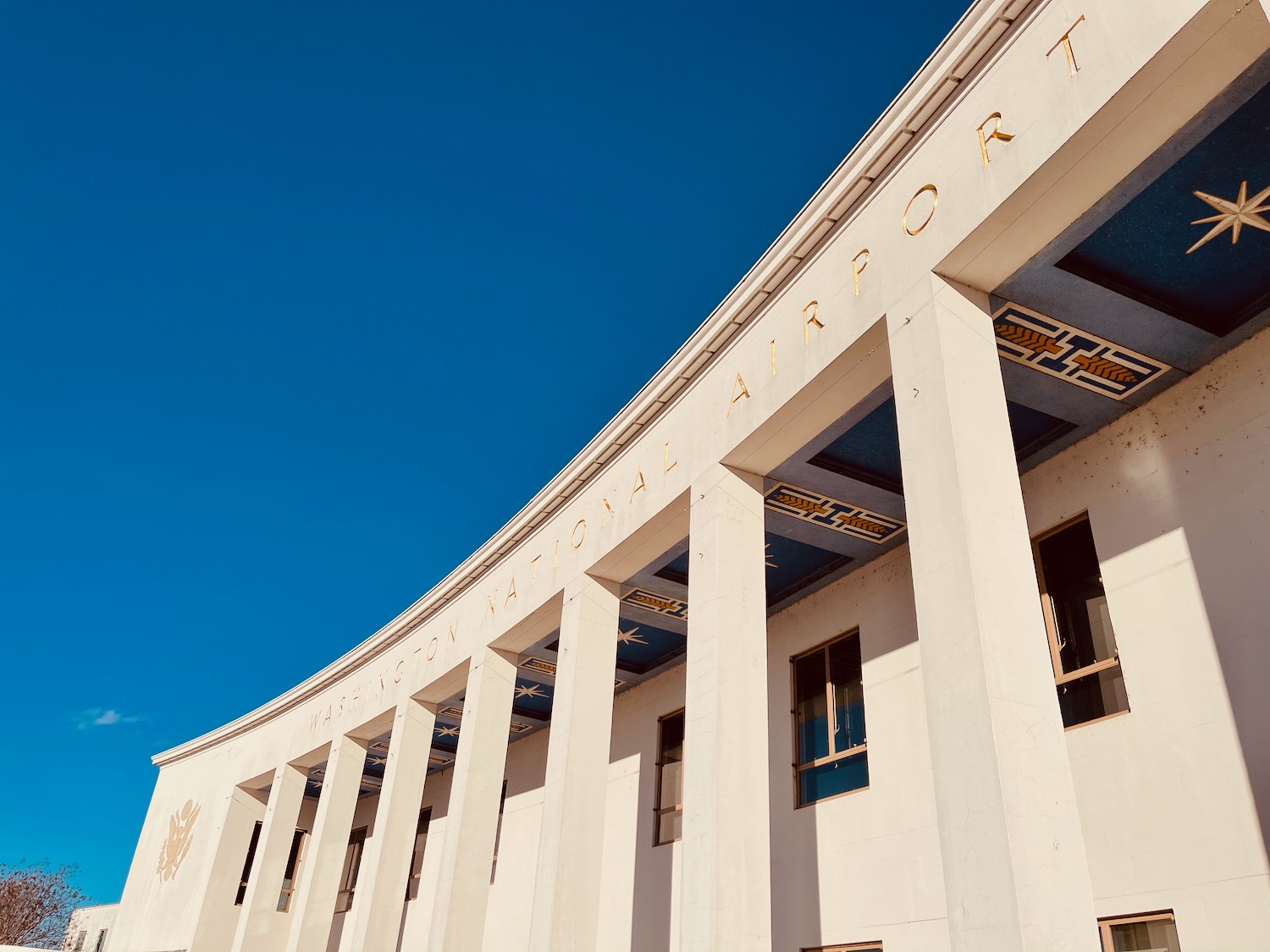 a building with columns and a blue sky