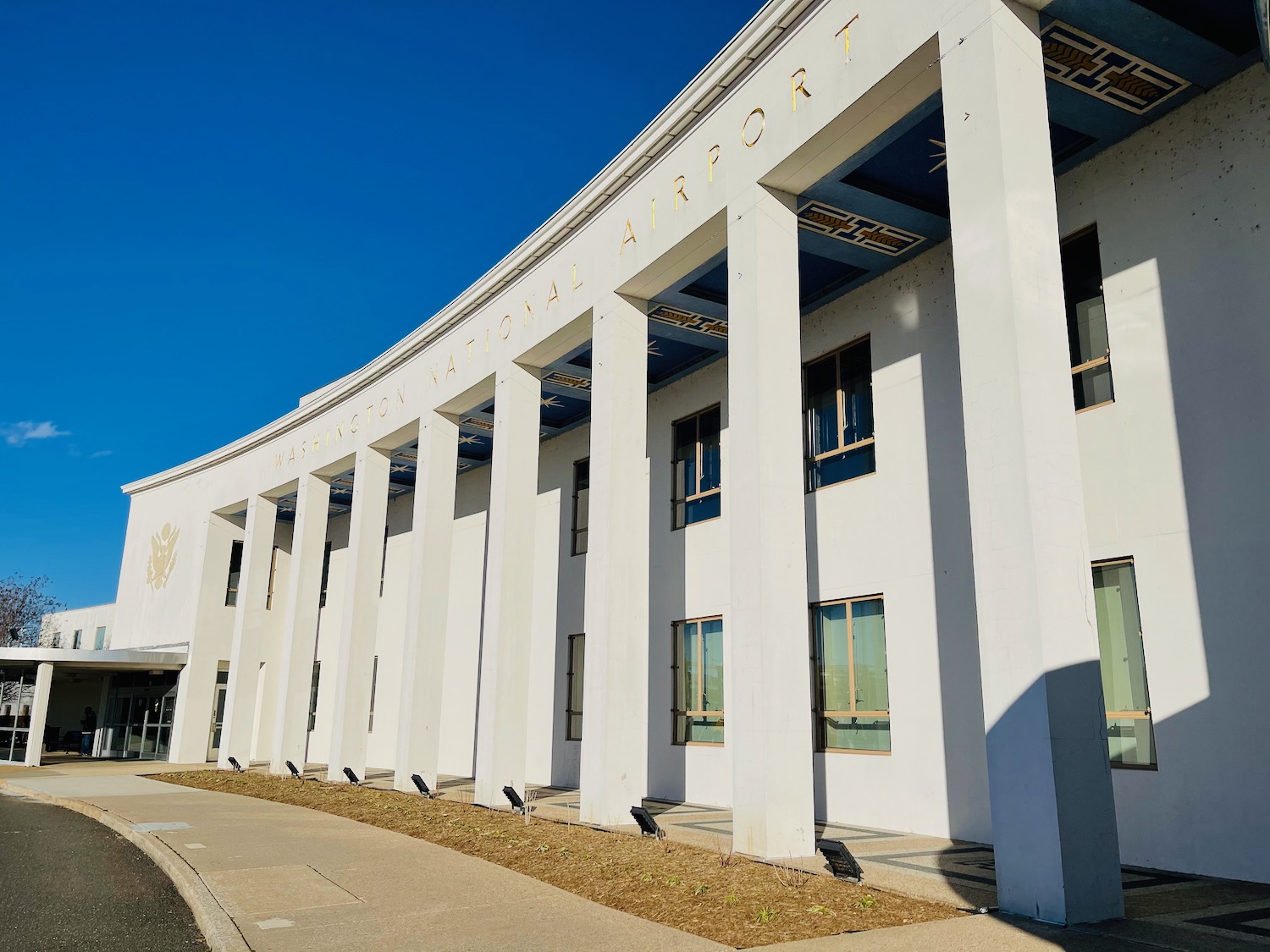 a building with columns and a sign on the front