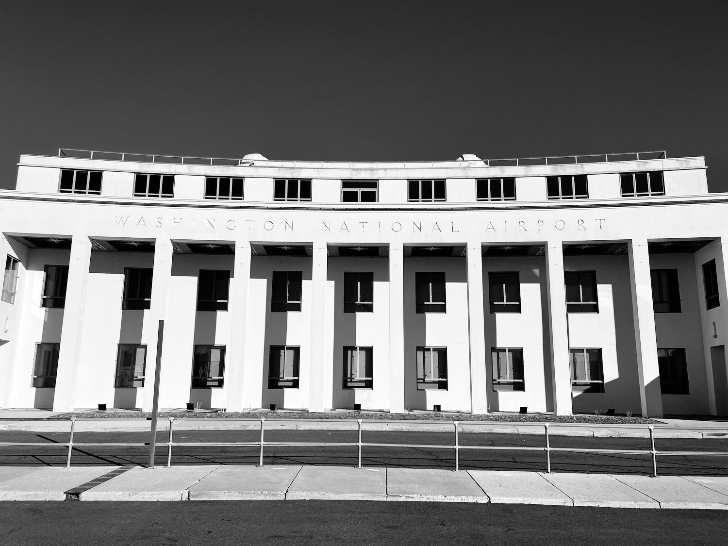 a building with columns and a sign