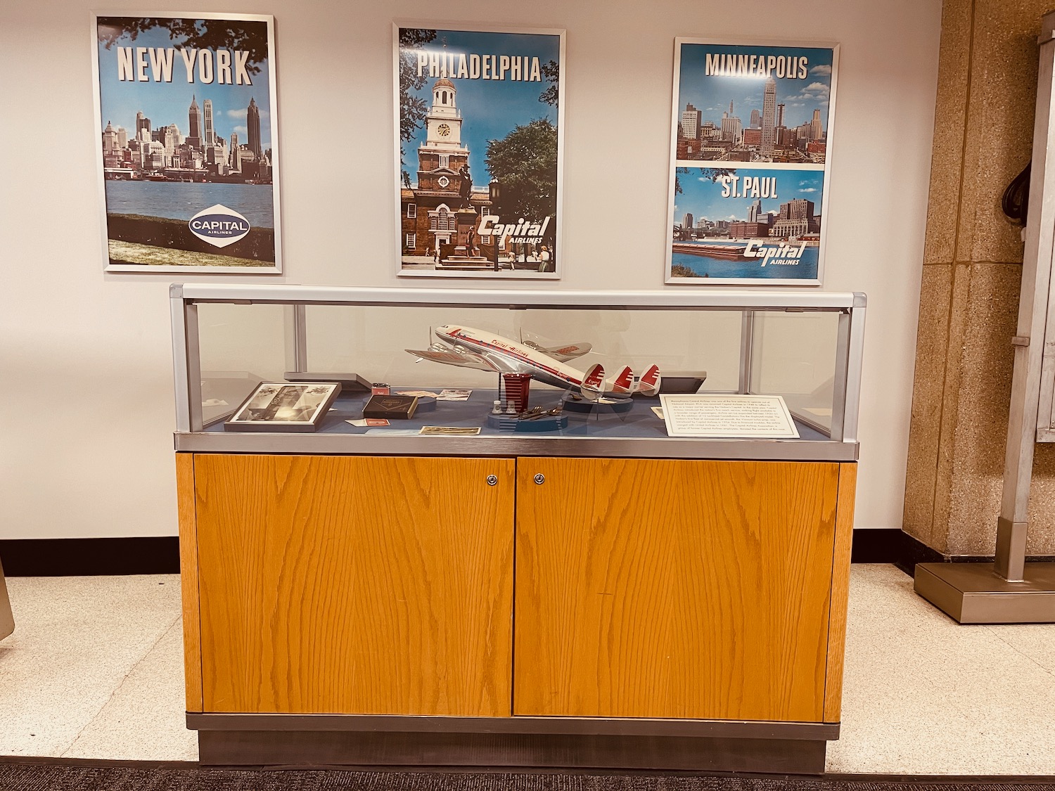 a display case with a model airplane in it