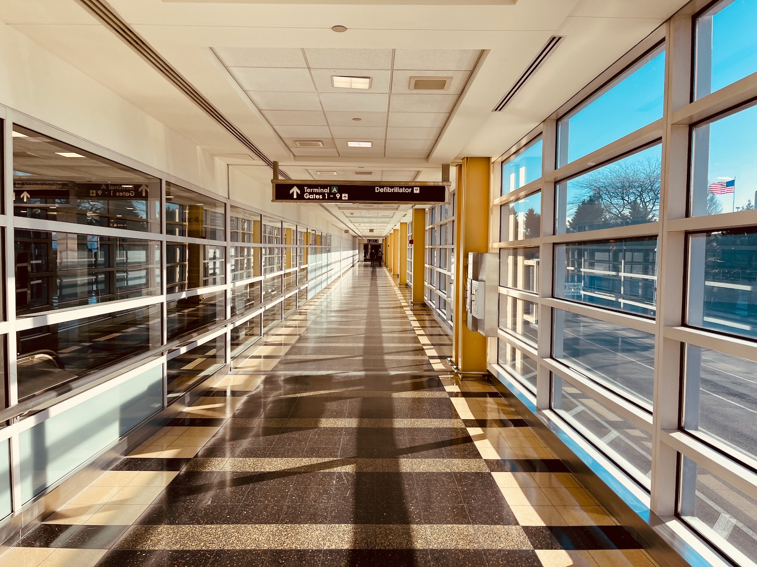 a long hallway with glass windows