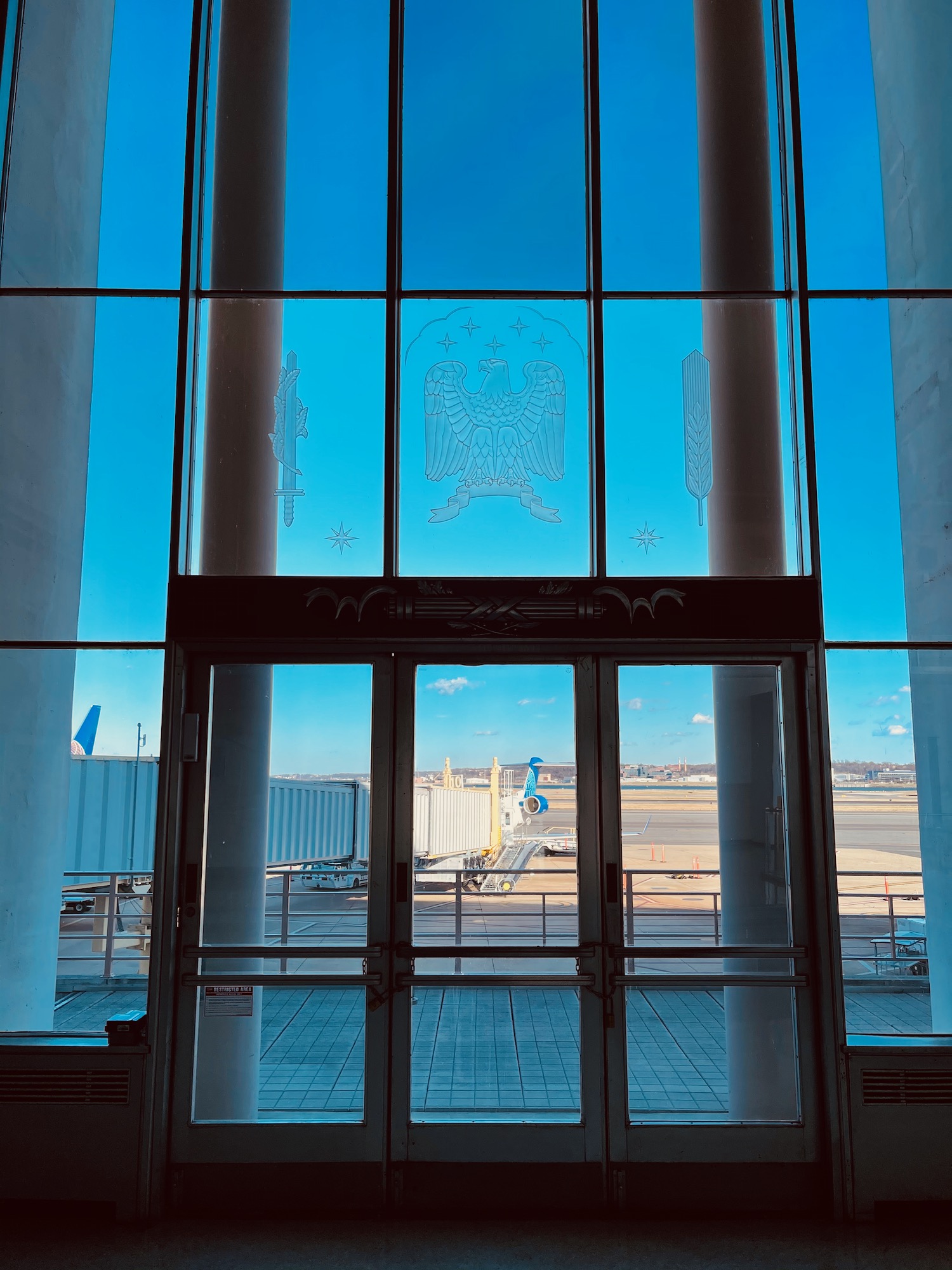 a glass door with a double eagle on it