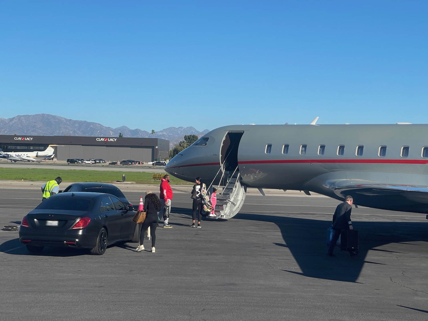 people boarding an airplane at an airport