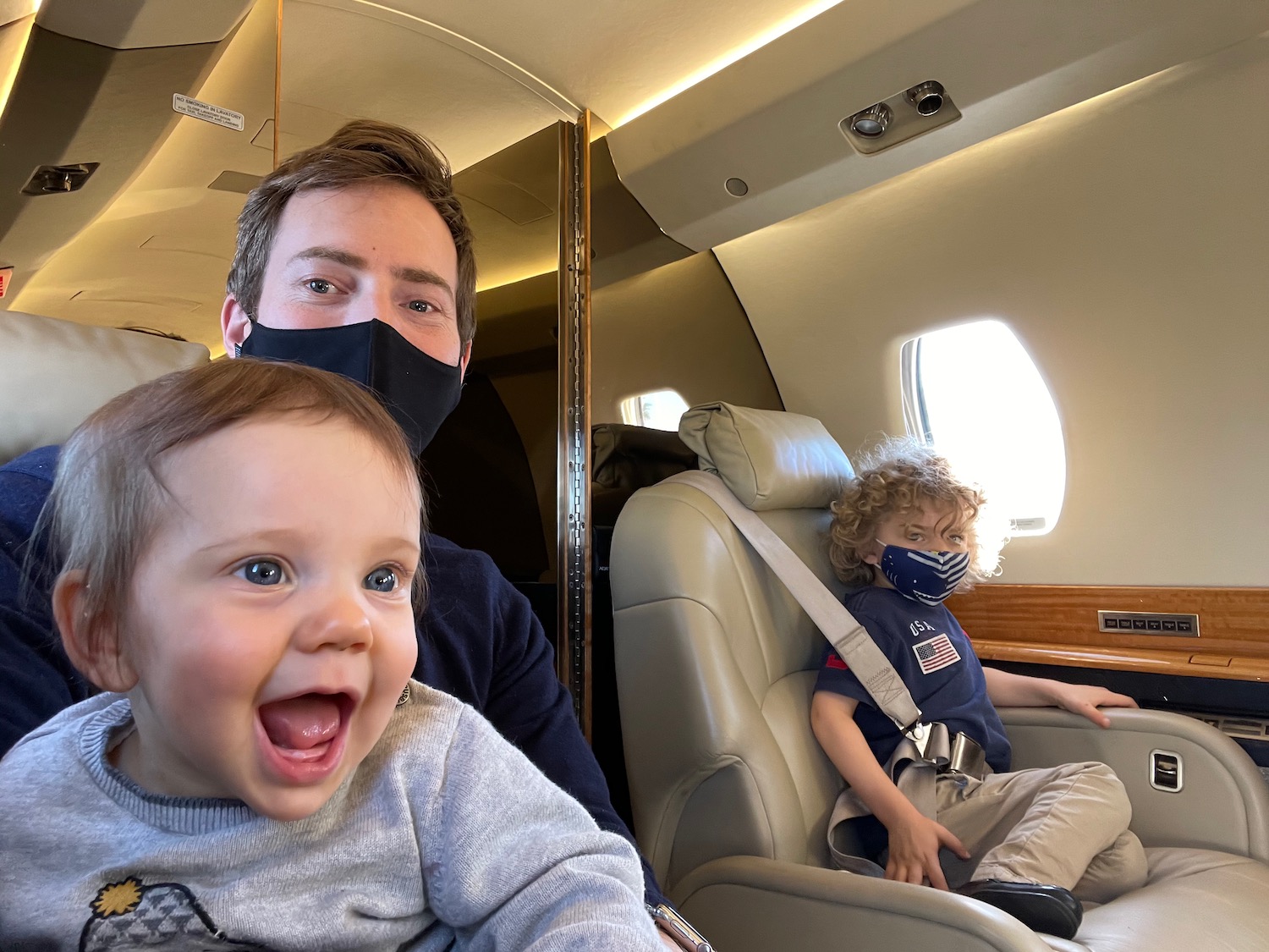 a man and a baby in a plane