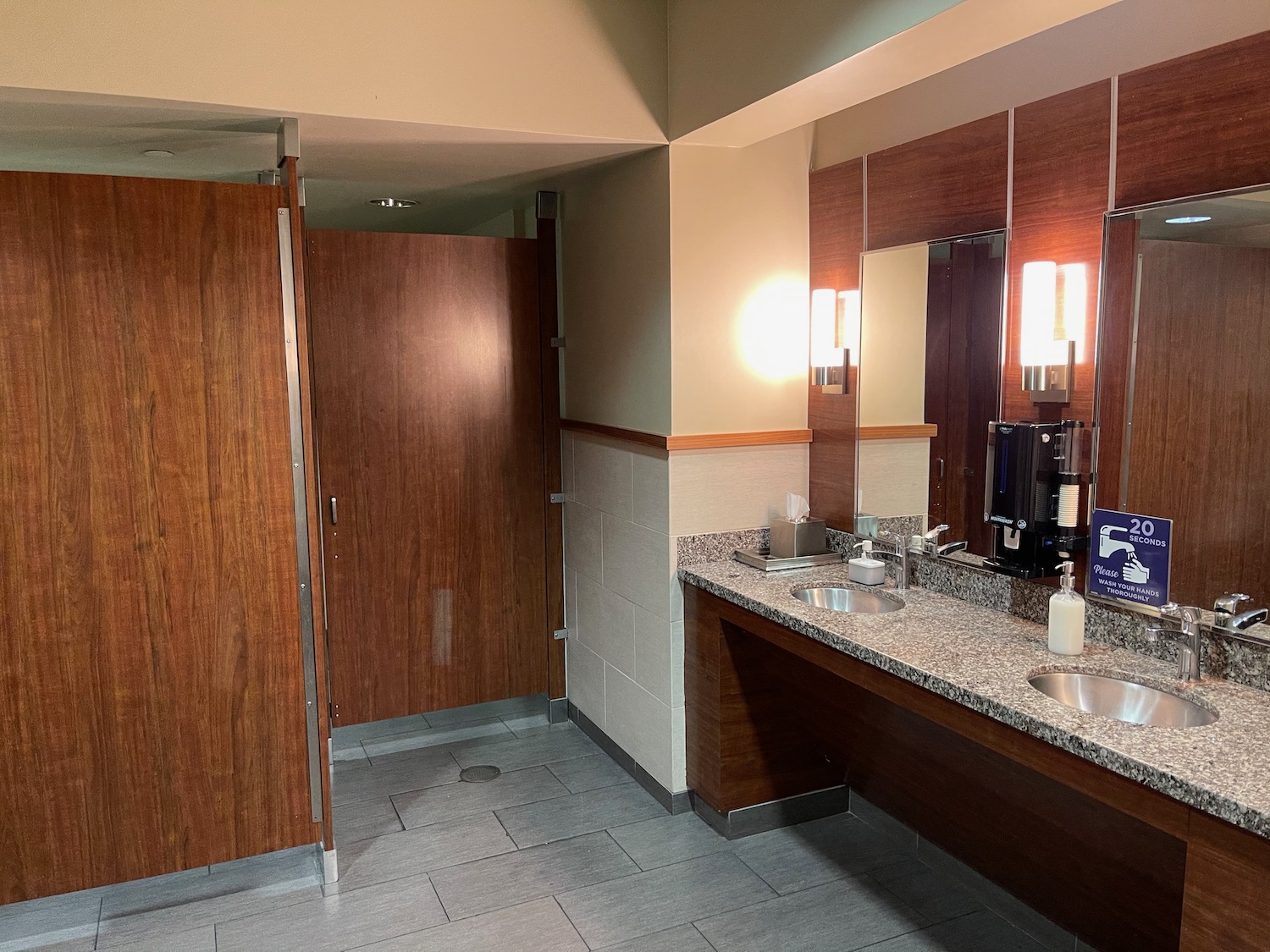 a bathroom with a marble countertop and two sinks