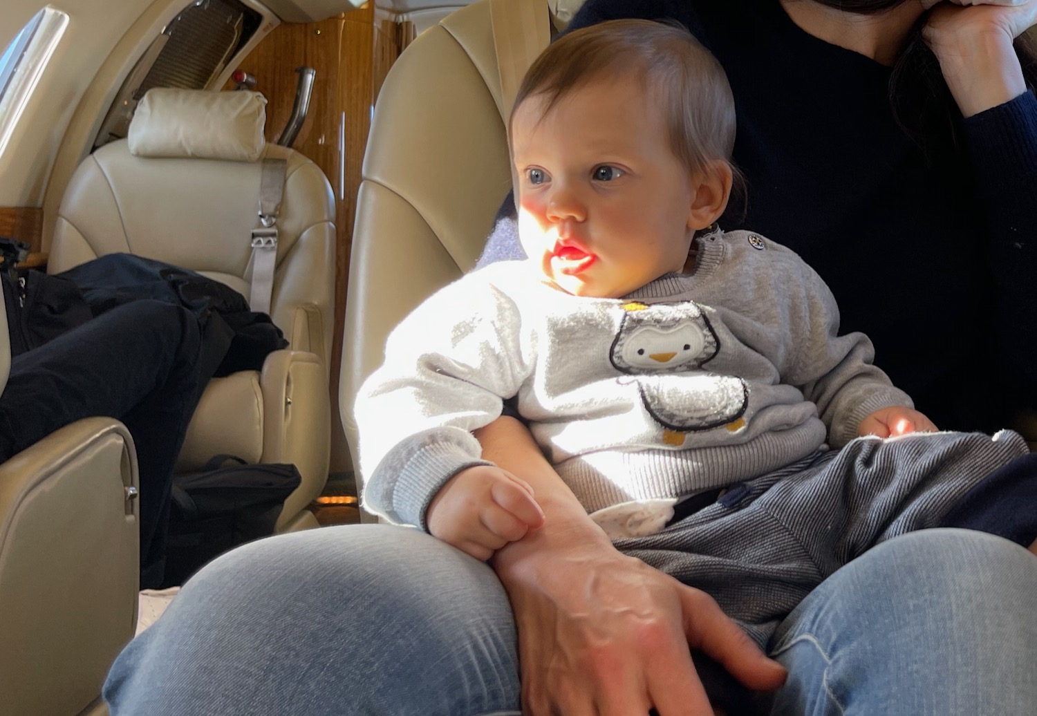 a baby sitting in a car